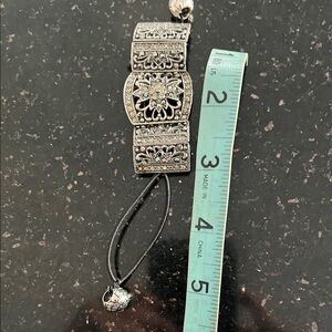 Intricate Silver Bracelet with Black Cord